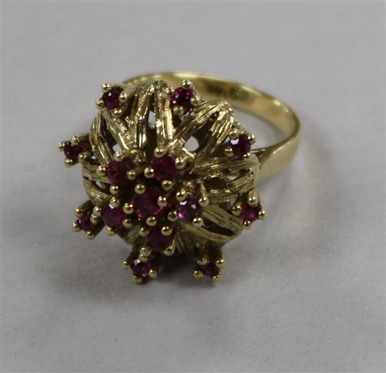 A 14ct gold and ruby set cocktail ring, size M.